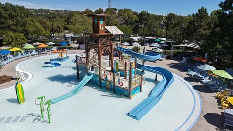 an aerial view of a swimming pool patio and mountain view