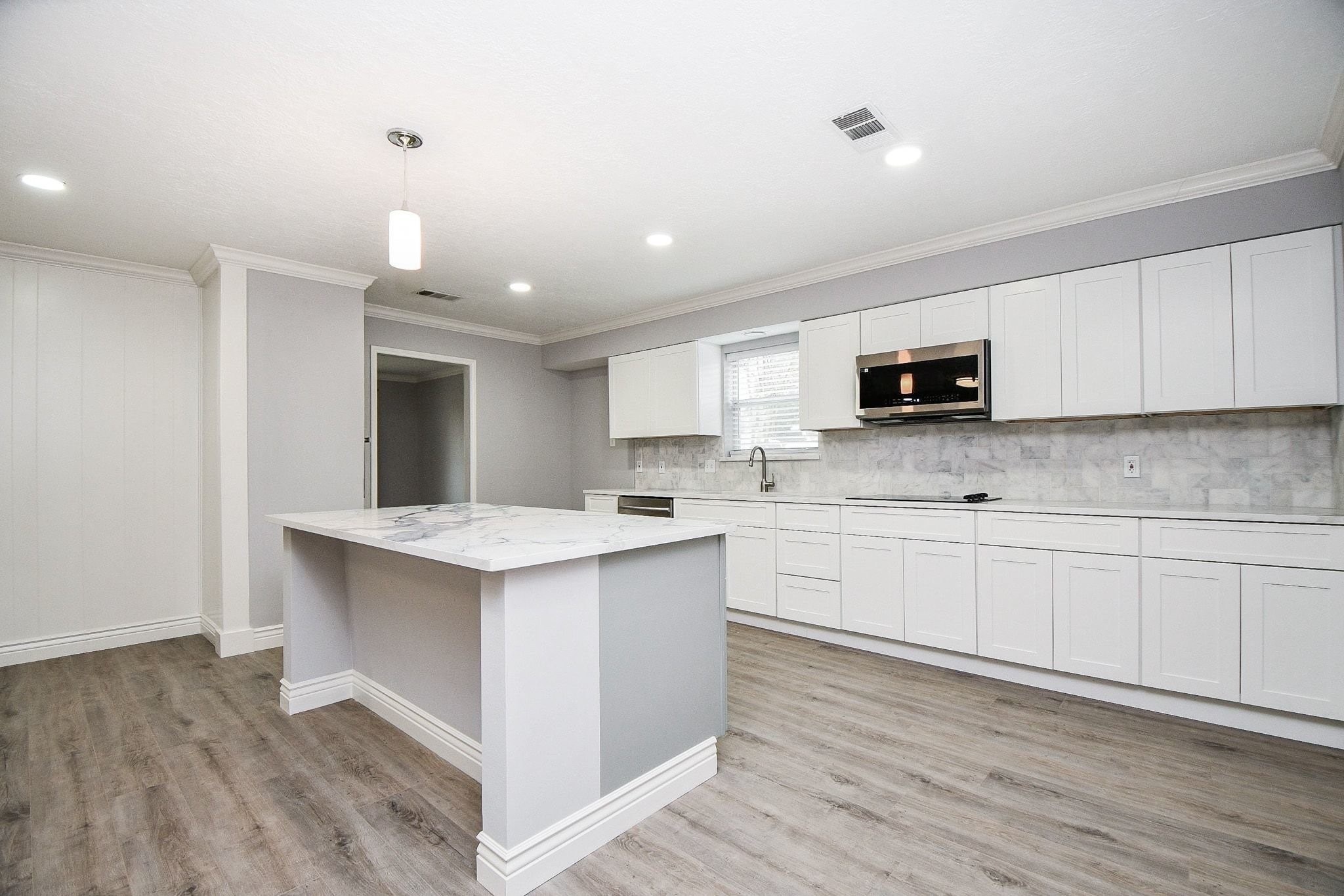 14011 Wickersham Lane Houston, TX 77077 - Photo 10 of 38 Freshly remodeled kitchen complete with new appliances and a large central island.