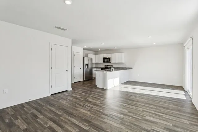 a view of kitchen with wooden floor
