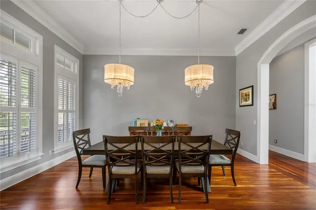 a view of a dining room with furniture window and wooden floor