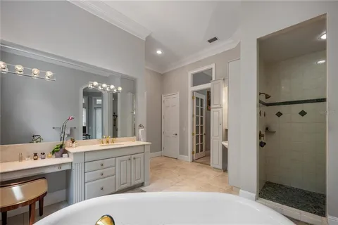 a spacious bathroom with a shower and a sink