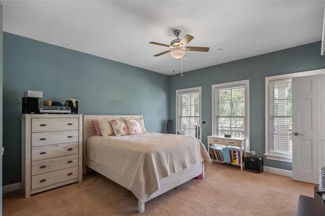 a spacious bathroom with a granite countertop sink a toilet and a shower