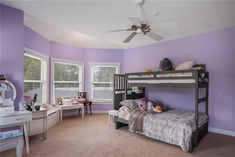 a bathroom with a granite countertop sink toilet a mirror and shower