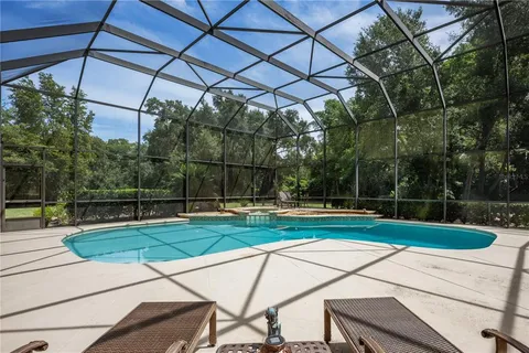 a view of a swimming pool with a patio