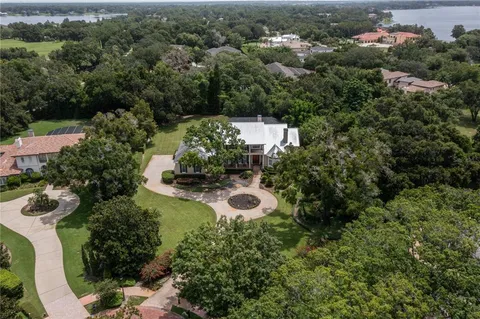 an aerial view of a house with outdoor space