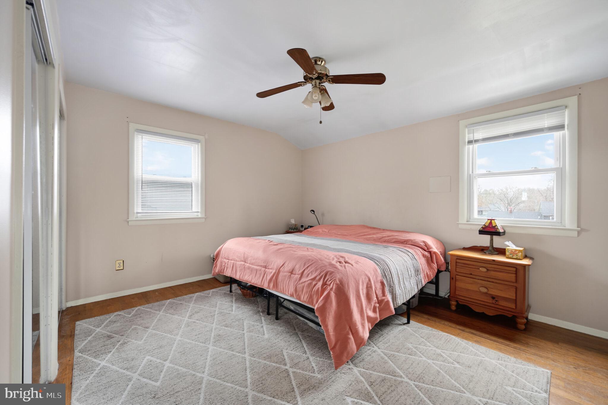 7507 Dover Lane Hyattsville, MD 20784 - Photo 21 of 53 a spacious bedroom with a bed and window