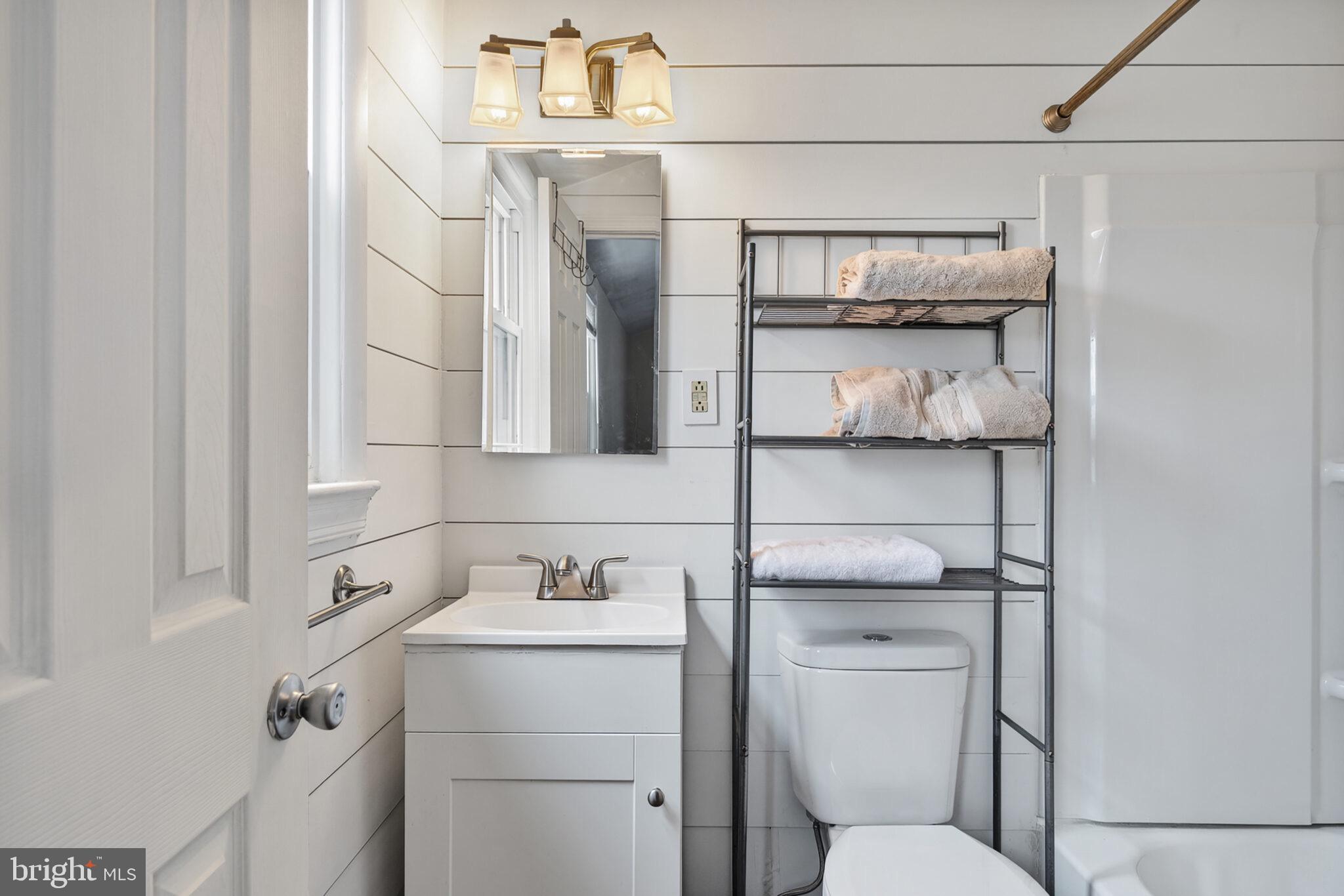 7507 Dover Lane Hyattsville, MD 20784 - Photo 23 of 53 a bathroom with a toilet sink and vanity