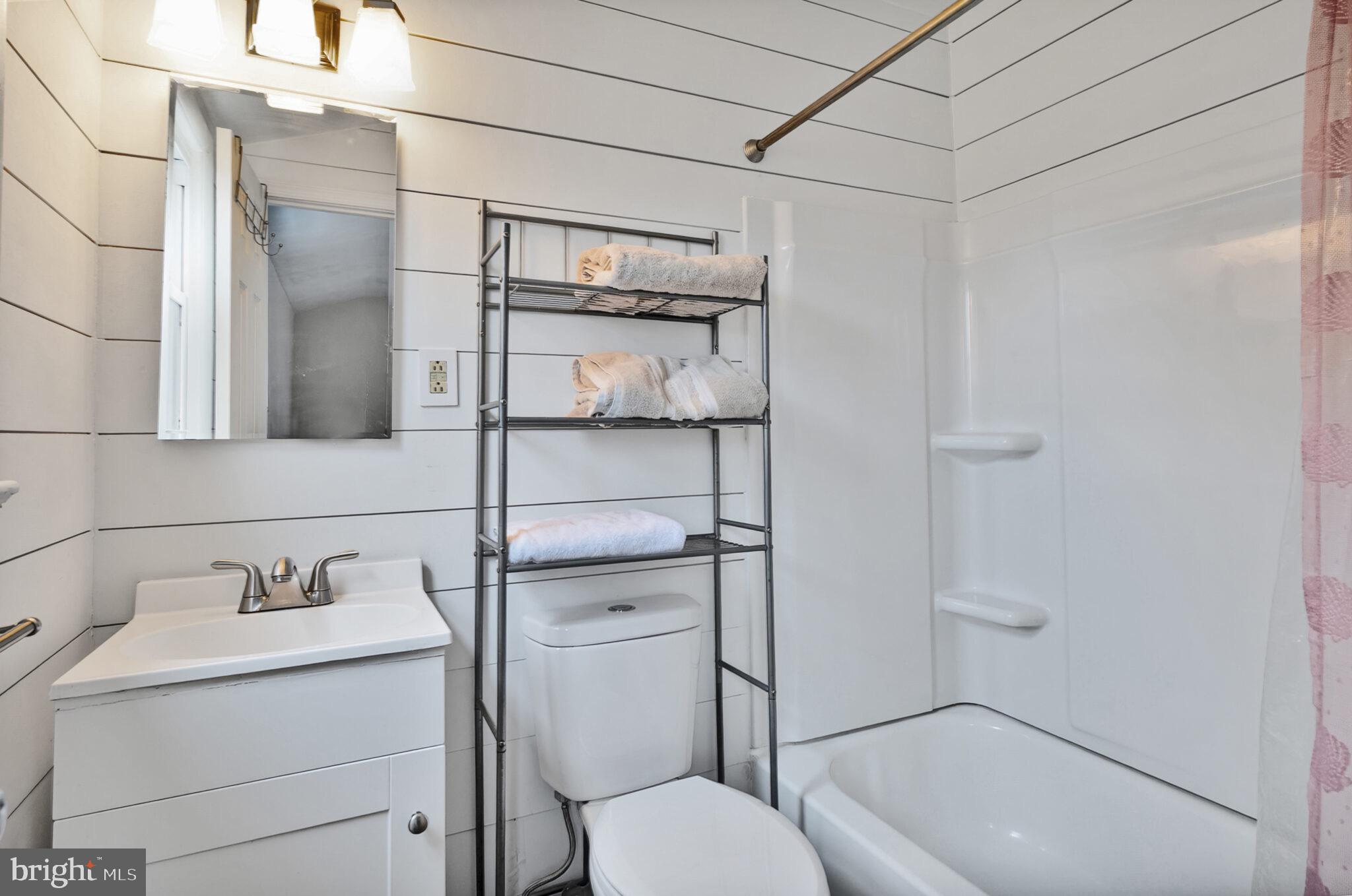 7507 Dover Lane Hyattsville, MD 20784 - Photo 24 of 53 a bathroom with a sink toilet and shower