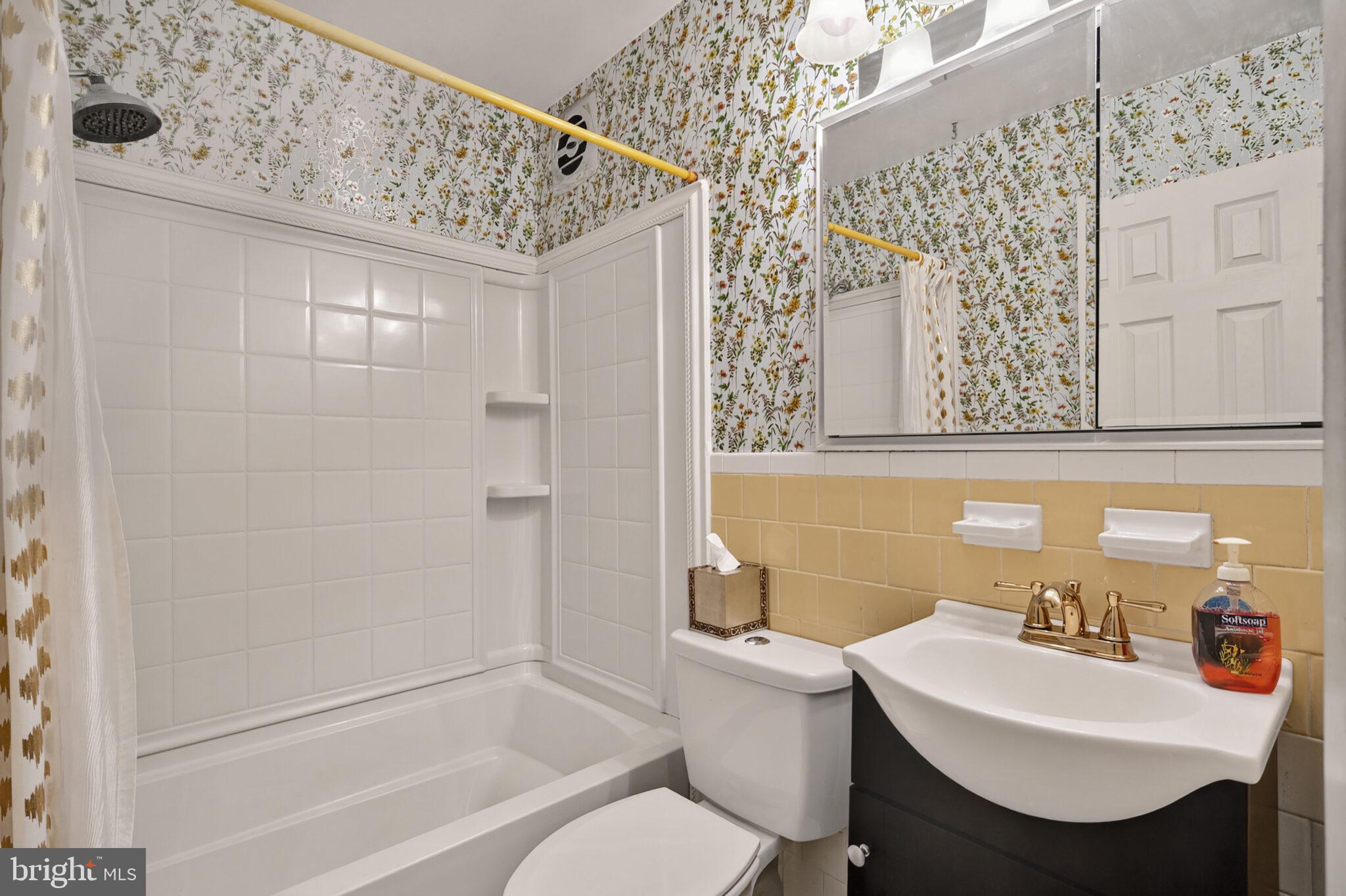 7507 Dover Lane Hyattsville, MD 20784 - Photo 27 of 53 a bathroom with a sink toilet and shower