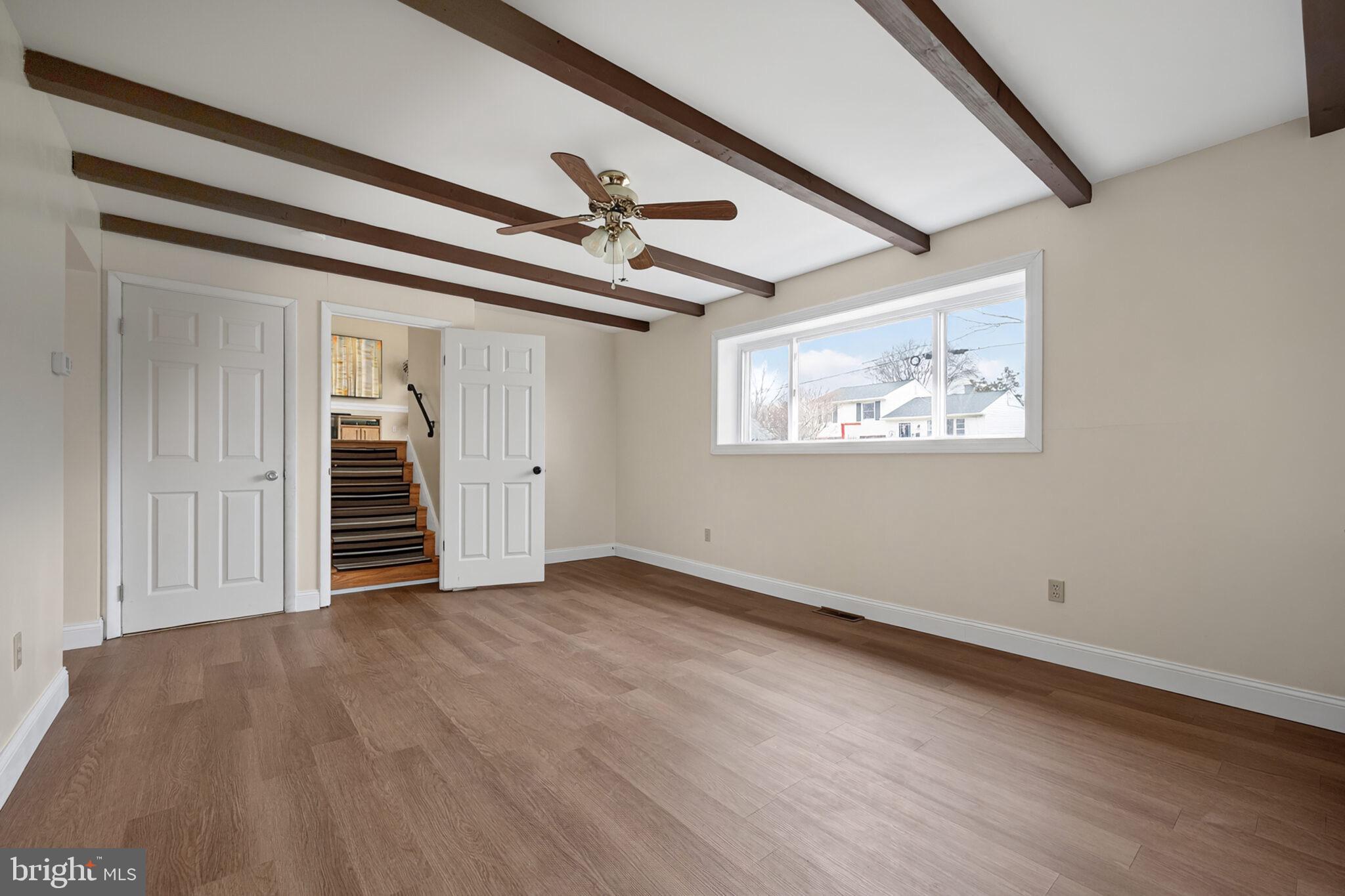 7507 Dover Lane Hyattsville, MD 20784 - Photo 31 of 53 an empty room with wooden floor closet and windows