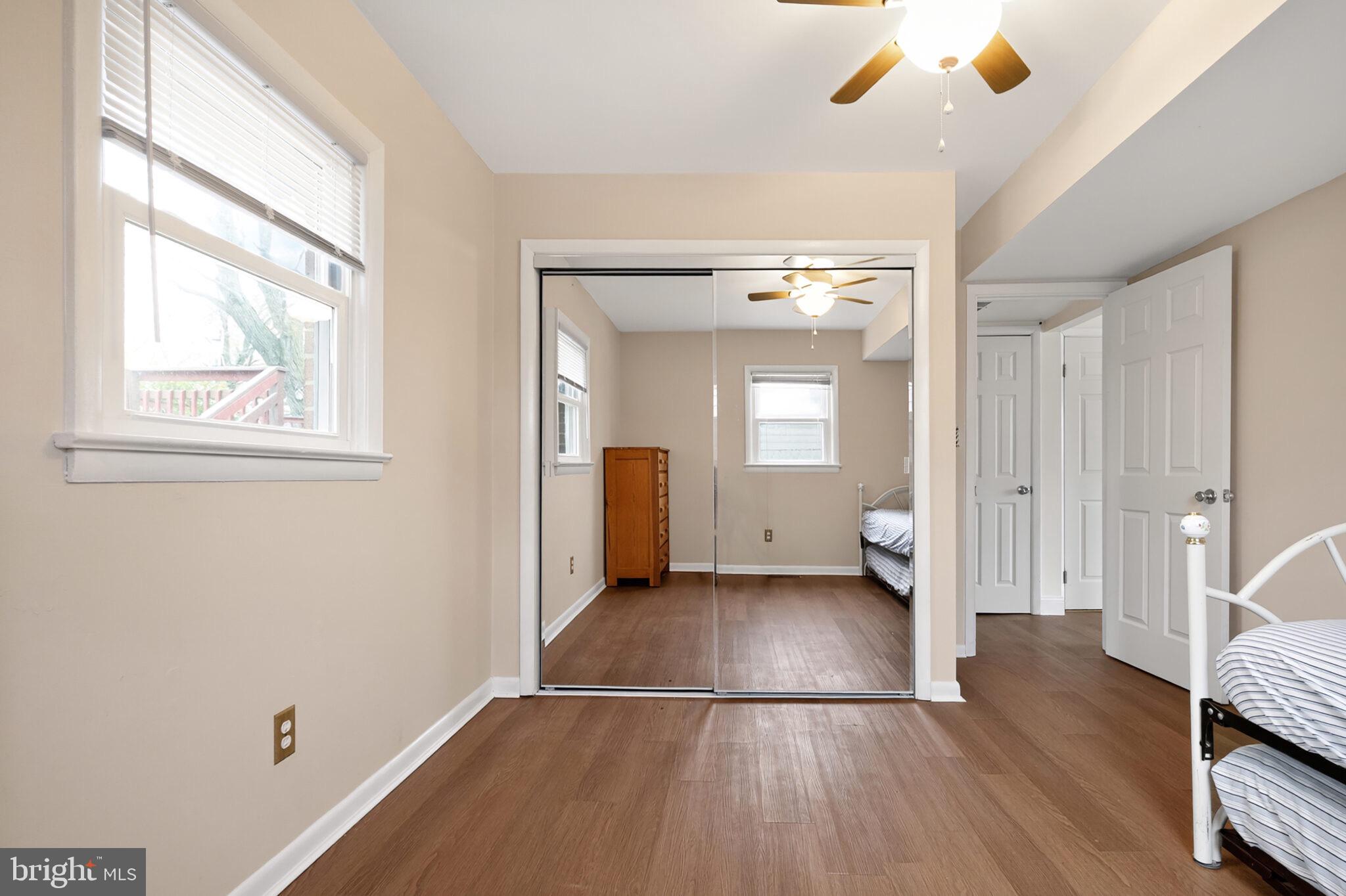 7507 Dover Lane Hyattsville, MD 20784 - Photo 33 of 53 wooden floor in an empty room with a window