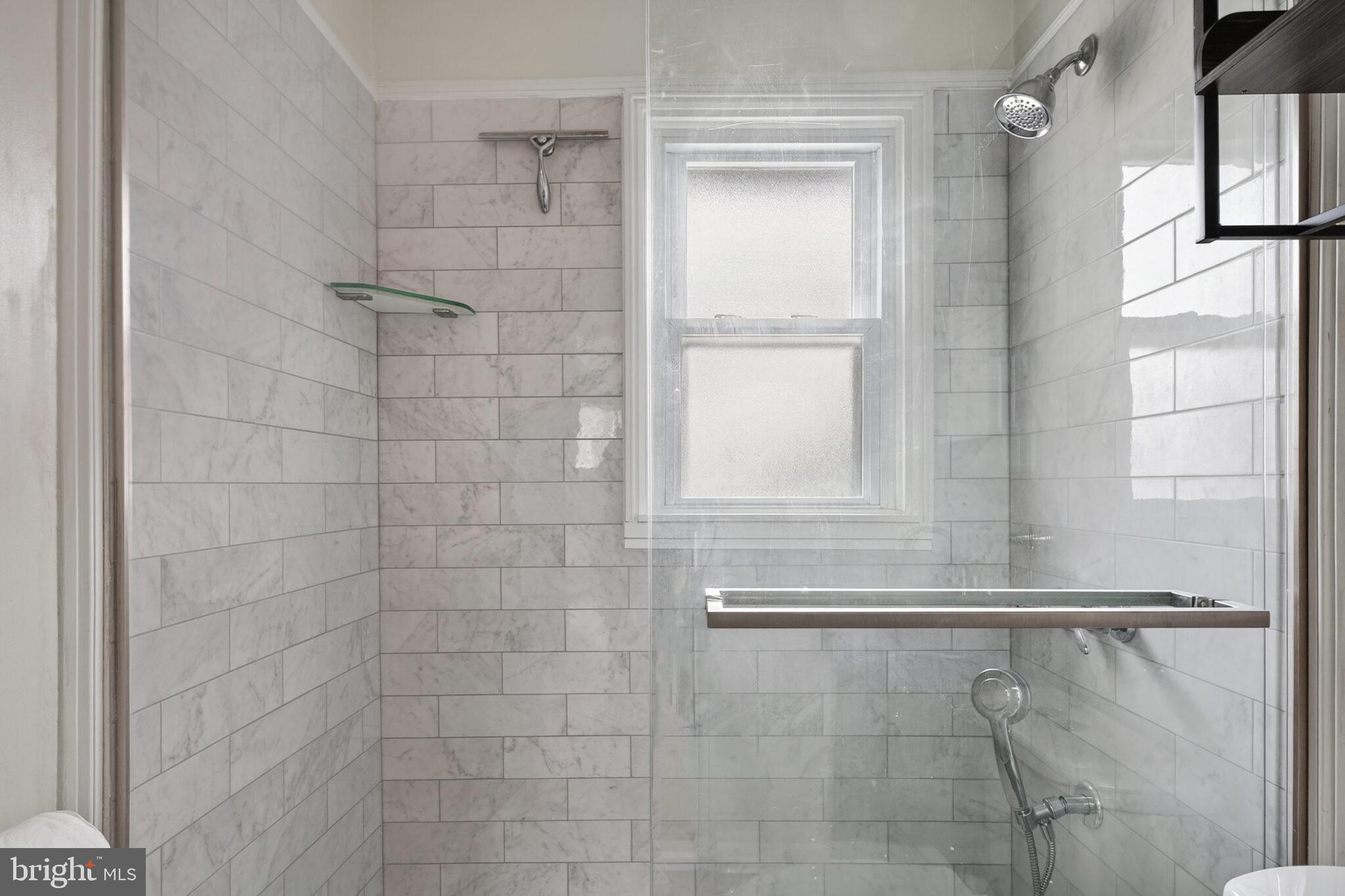 7507 Dover Lane Hyattsville, MD 20784 - Photo 35 of 53 a bathroom with a shower