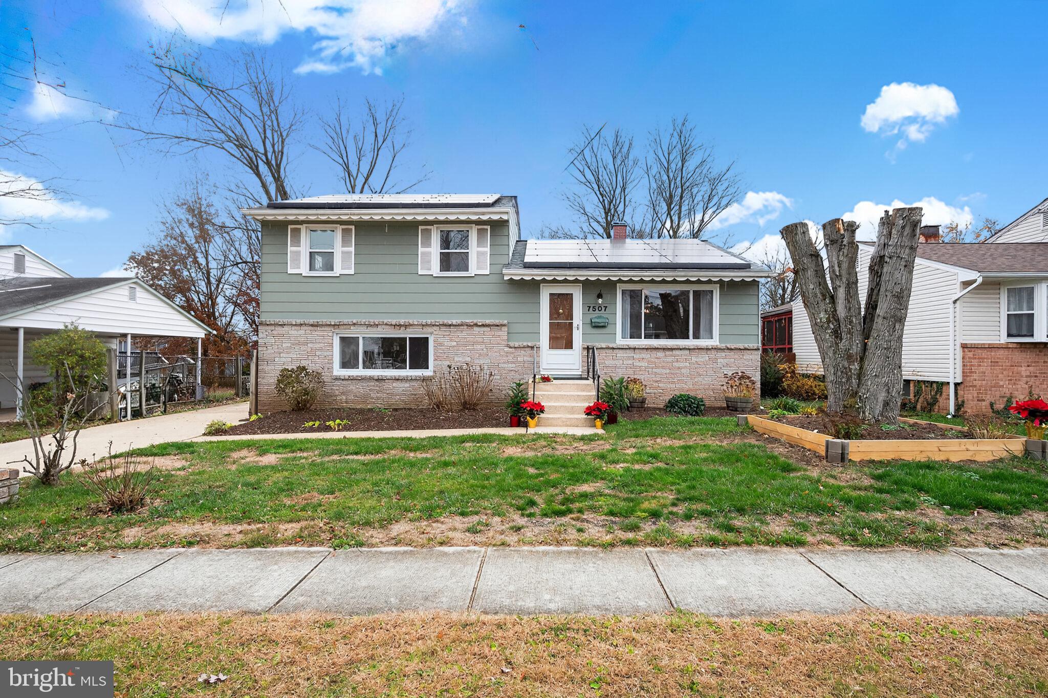 7507 Dover Lane Hyattsville, MD 20784 - Photo 44 of 53 a front view of a house with a yard
