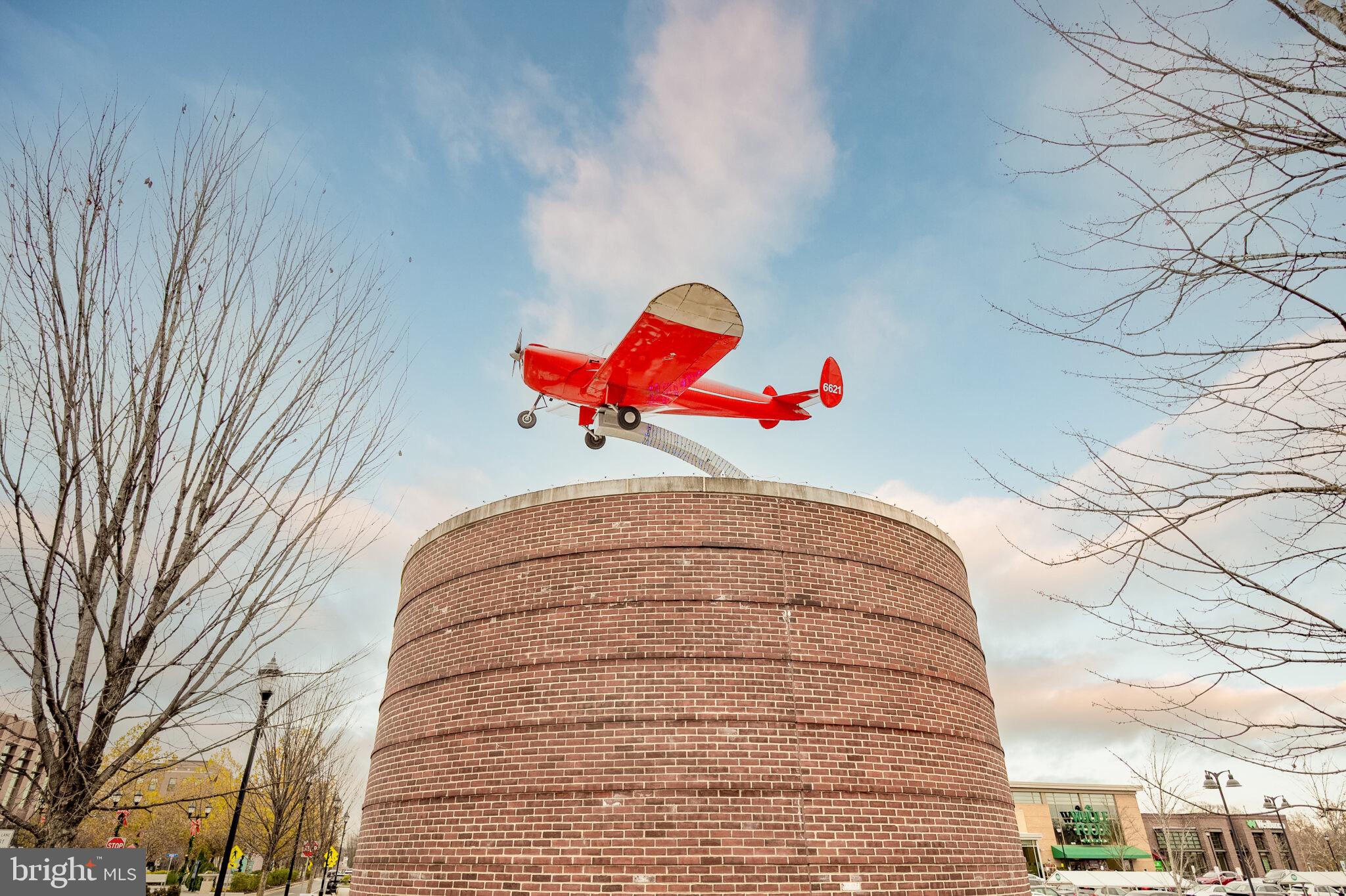 7507 Dover Lane Hyattsville, MD 20784 - Photo 48 of 53 a white house with a small yard and a large tree