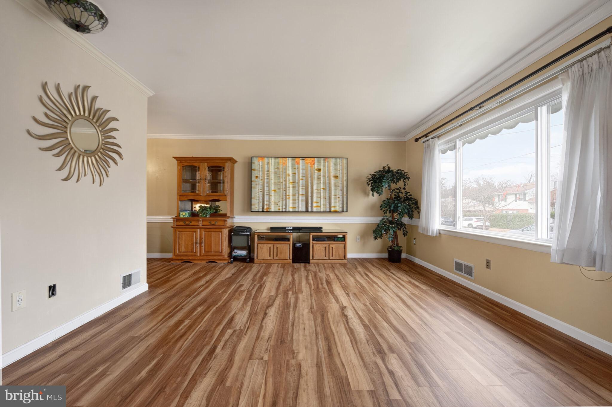 7507 Dover Lane Hyattsville, MD 20784 - Photo 7 of 53 a living room with furniture and a large window
