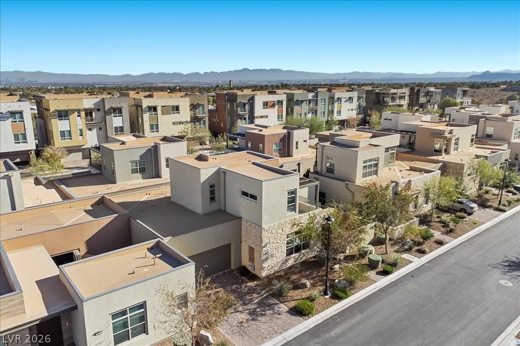 4262 Swift Street Las Vegas, NV 89135 - Photo 45 of 75 Aerial view of residential area featuring a mountain backdrop