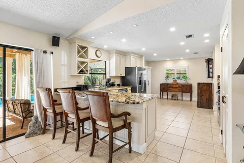a kitchen with stainless steel appliances a stove a sink and a refrigerator