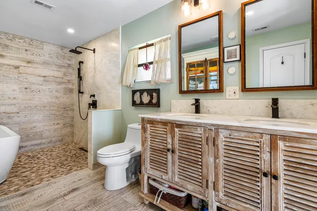 a bathroom with a bathtub and shower