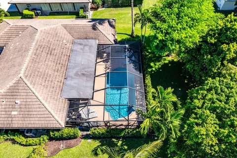 an aerial view of a house with a garden