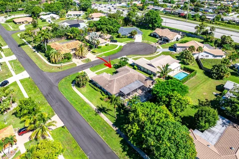 an aerial view of residential houses with outdoor space