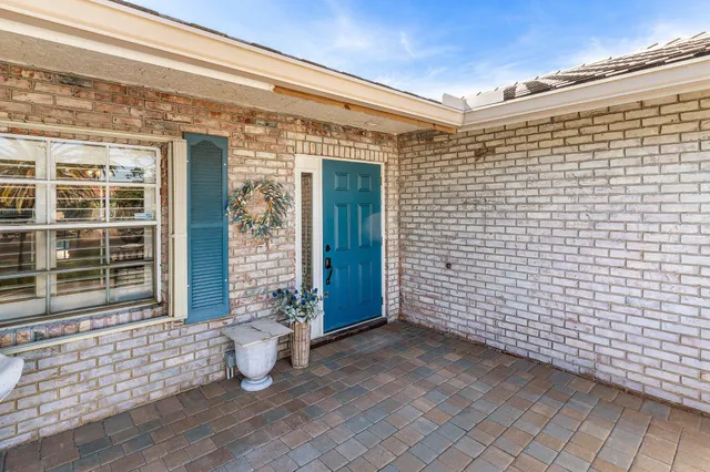 a bathroom with a glass shower door and a mirror