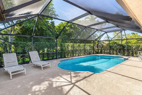 a view of swimming pool with a patio