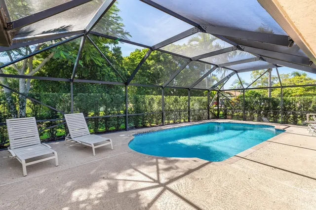 a view of swimming pool with a patio