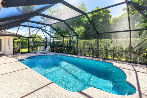 a view of a swimming pool with a patio