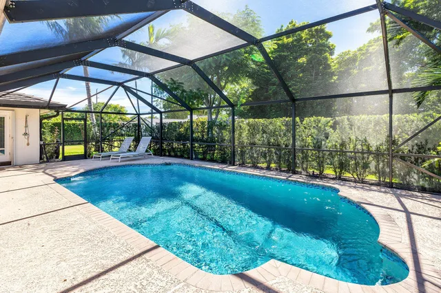 a view of a swimming pool with a patio