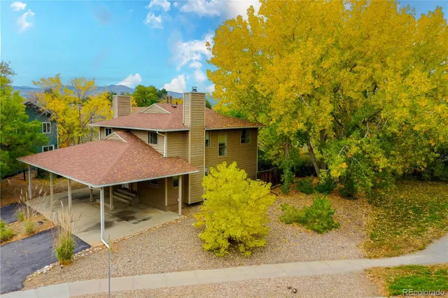 a view of a patio with table and chairs and potted plants