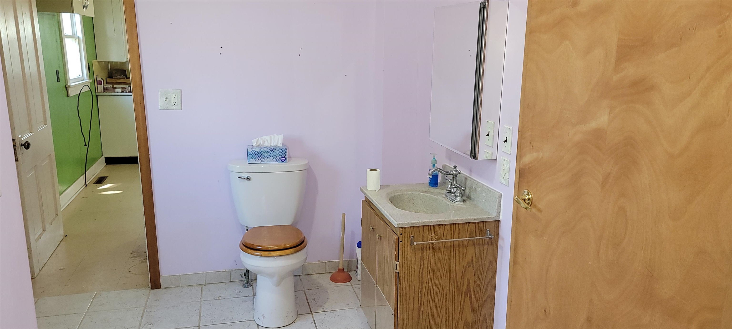 4100 West McConnell Road McConnell, IL 61050 - Photo 11 of 39 a bathroom with a sink mirror toilet and next to a window