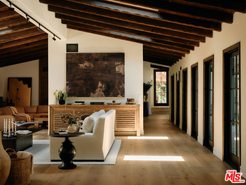 11945 Lockridge Road Studio City, CA 91604 - Photo 12 of 36 a view of living room with furniture and a floor to ceiling window