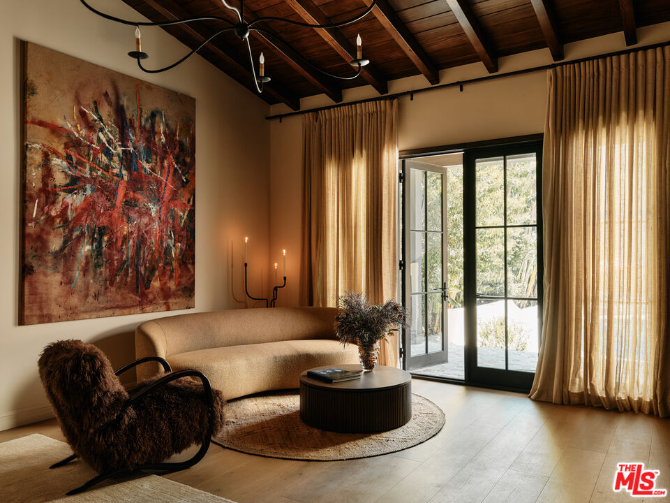 11945 Lockridge Road Studio City, CA 91604 - Photo 16 of 36 a living room with furniture and a large window