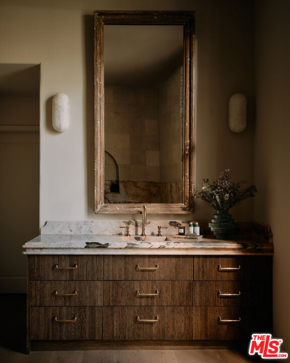 11945 Lockridge Road Studio City, CA 91604 - Photo 18 of 36 a bathroom with a sink and a mirror