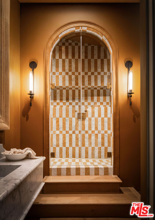 11945 Lockridge Road Studio City, CA 91604 - Photo 22 of 36 a bathroom with a sink and a mirror