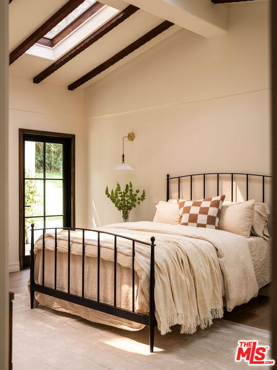 11945 Lockridge Road Studio City, CA 91604 - Photo 24 of 36 a bedroom with a bed and a window