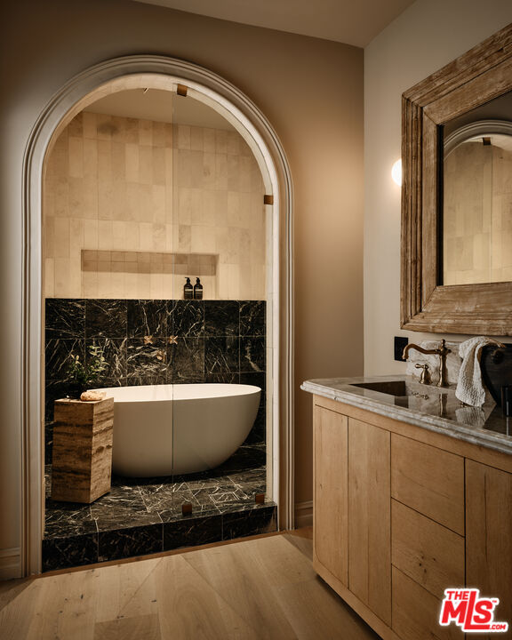 11945 Lockridge Road Studio City, CA 91604 - Photo 25 of 36 a bathroom with a sink and a mirror