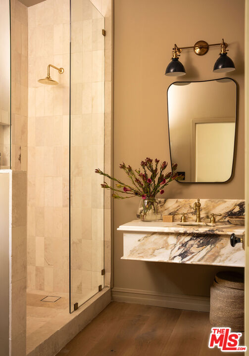11945 Lockridge Road Studio City, CA 91604 - Photo 27 of 36 a bathroom with a sink and mirror