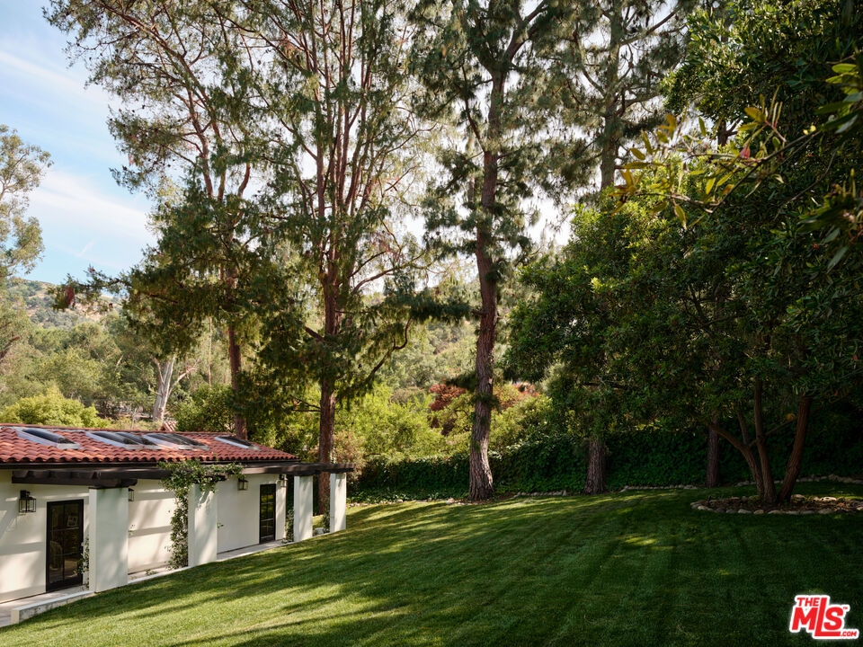 11945 Lockridge Road Studio City, CA 91604 - Photo 33 of 36 a view of a house with a yard