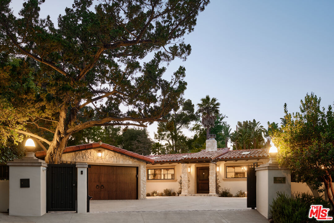 11945 Lockridge Road Studio City, CA 91604 - Photo 34 of 36 a front view of a house with a tree