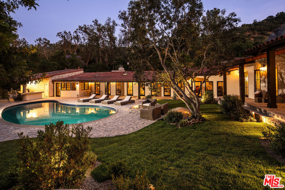 11945 Lockridge Road Studio City, CA 91604 - Photo 35 of 36 a view of yard with swimming pool and trees
