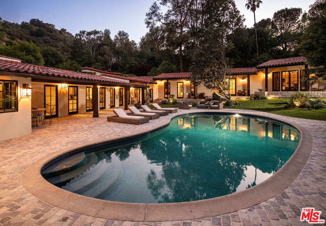 11945 Lockridge Road Studio City, CA 91604 - Photo 36 of 36 a view of a swimming pool with a patio