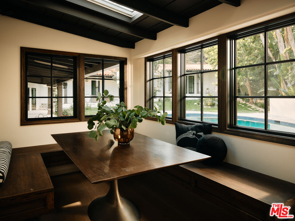 11945 Lockridge Road Studio City, CA 91604 - Photo 6 of 36 a dining room with table and chairs