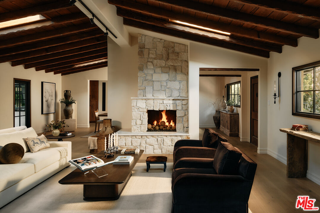 11945 Lockridge Road Studio City, CA 91604 - Photo 9 of 36 a living room with furniture and a fireplace