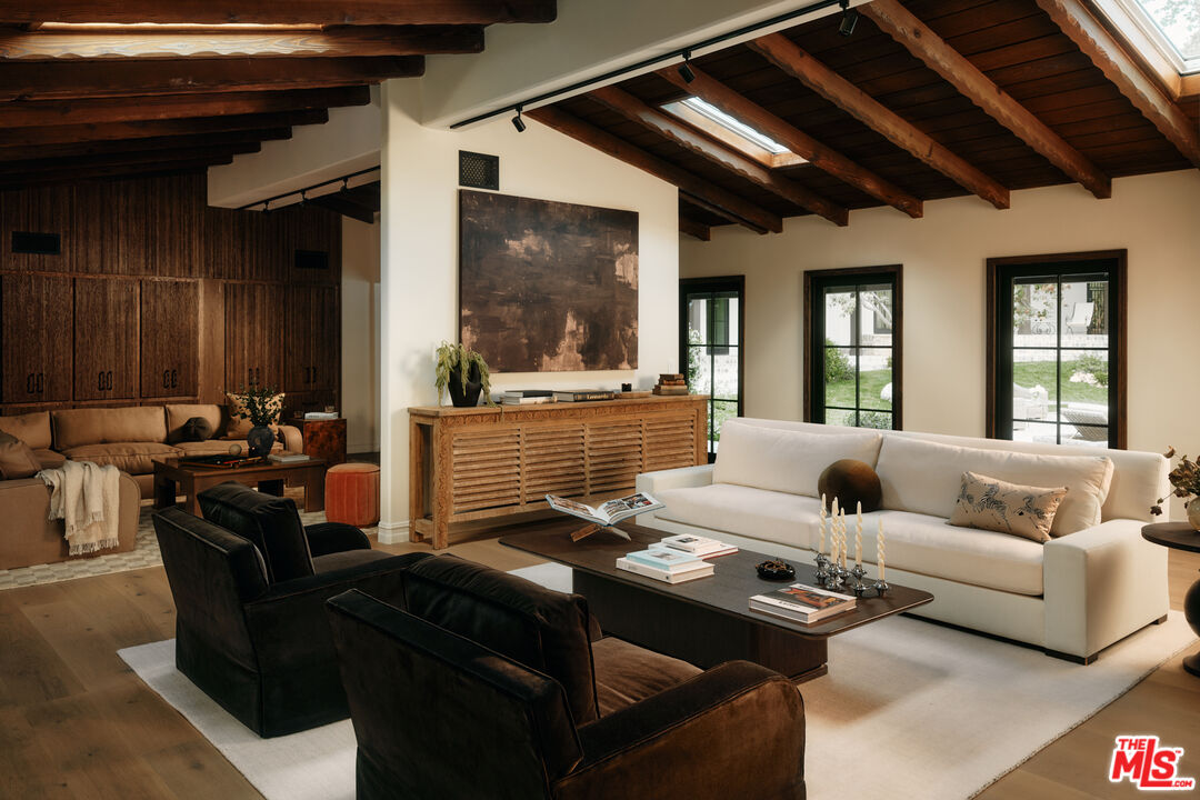 11945 Lockridge Road Studio City, CA 91604 - Photo 10 of 36 a living room with furniture and a large window