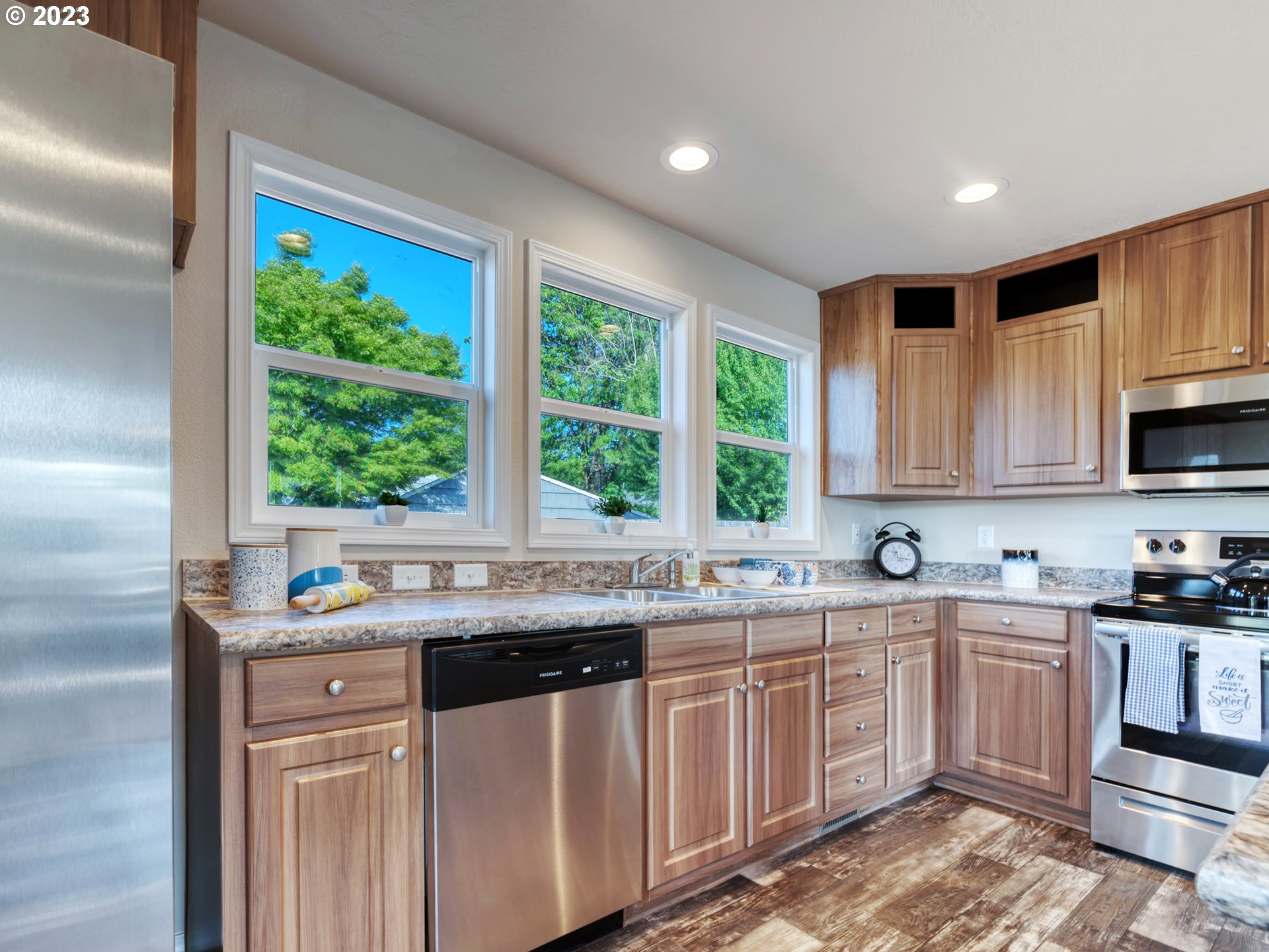 4689 Union Terrace Springfield, OR 97478 - Photo 8 of 24 a kitchen with a sink stove and cabinets