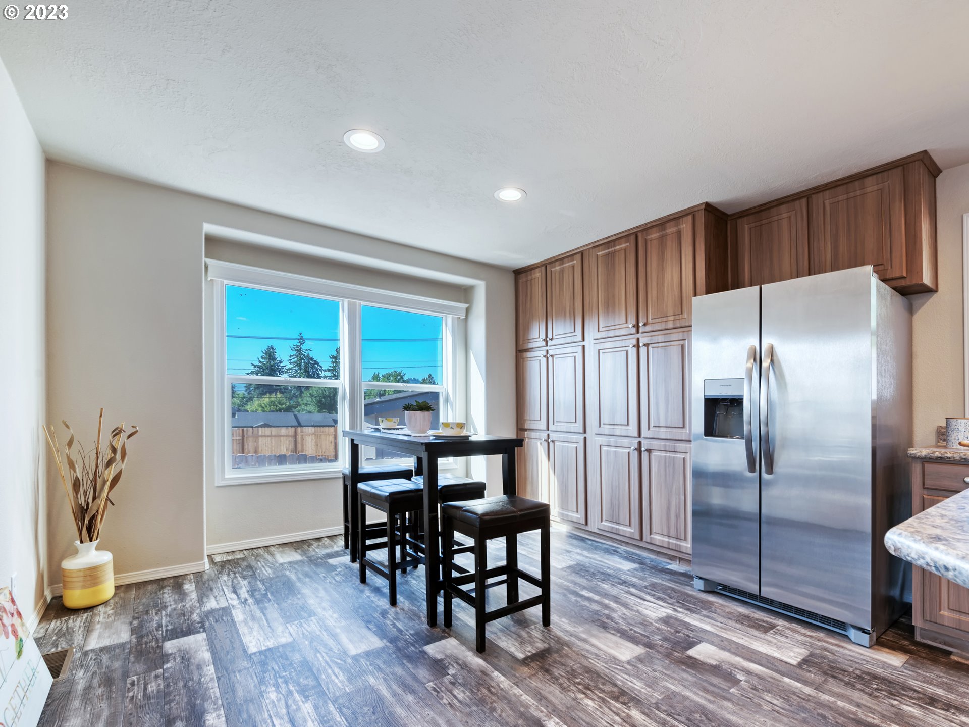4689 Union Terrace Springfield, OR 97478 - Photo 10 of 24 a view of a kitchen with dining room and wooden floor