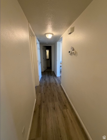 72 300 North, Unit 302 Provo, UT 84601 - Photo 13 of 16 Hallway featuring wood-finish flooring and light-toned walls