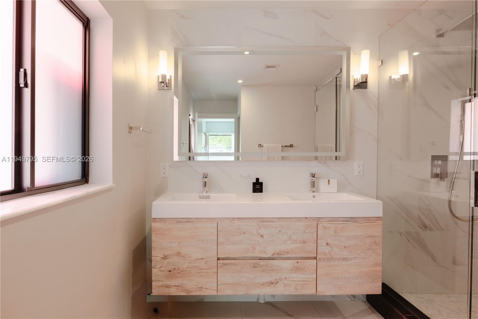 6201 Southwest 36th Street Miami, FL 33155 - Photo 11 of 43 a bathroom with a double vanity sink mirror and