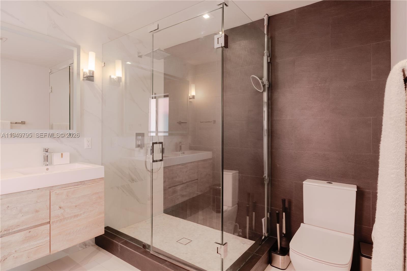 6201 Southwest 36th Street Miami, FL 33155 - Photo 12 of 43 a bathroom with a shower sink mirror and toilet